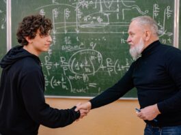 professor and a student shaking hands