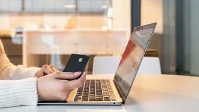 woman with credit card and laptop